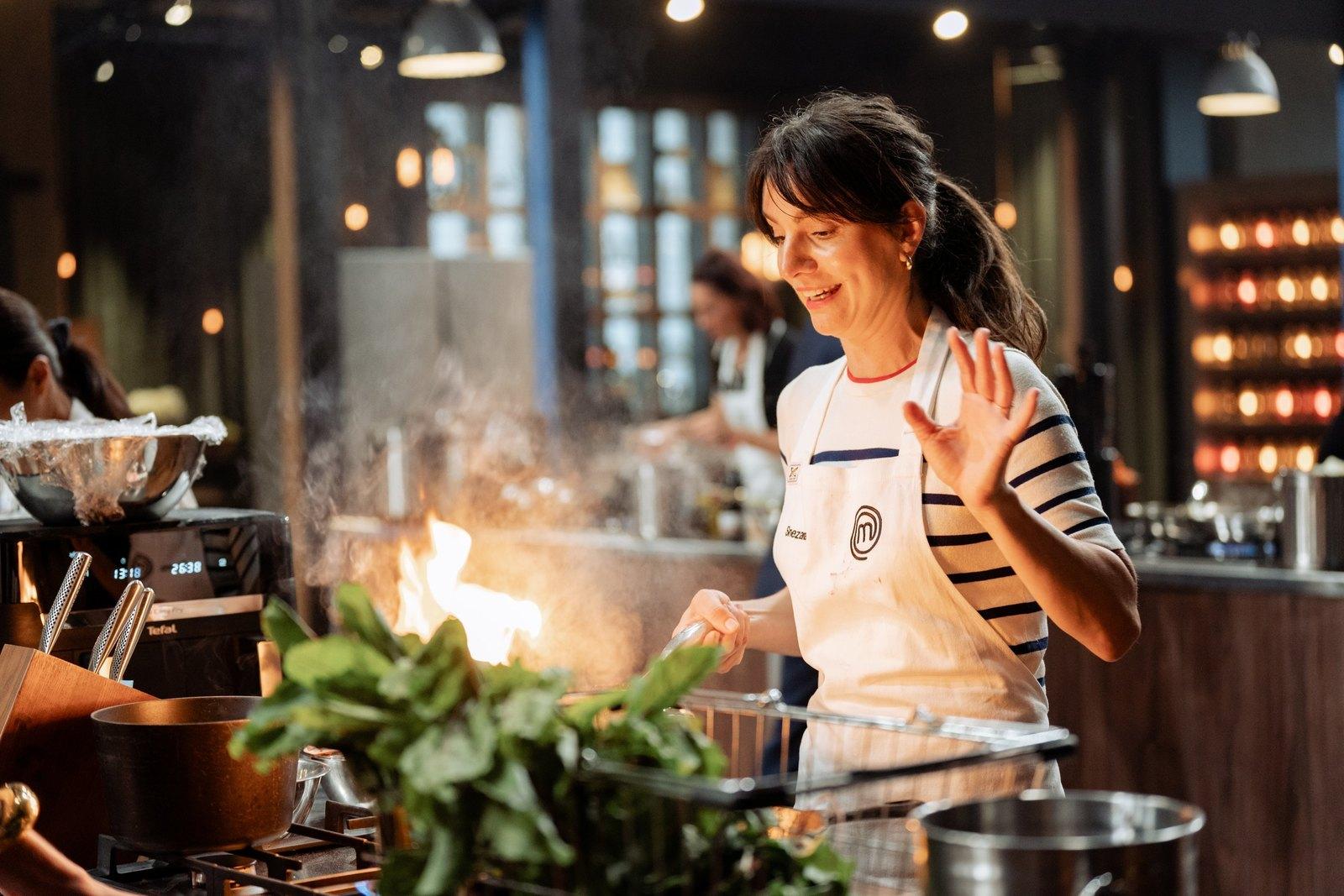 Snezana cooking over a flame in the MasterChef Australia kitchen